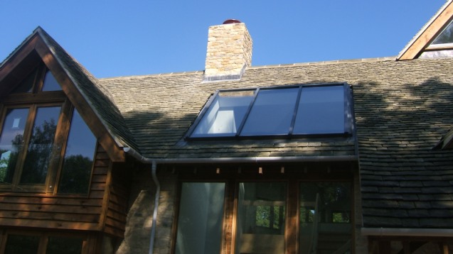 Oak-framed house with a new tiled roof and roof windows
