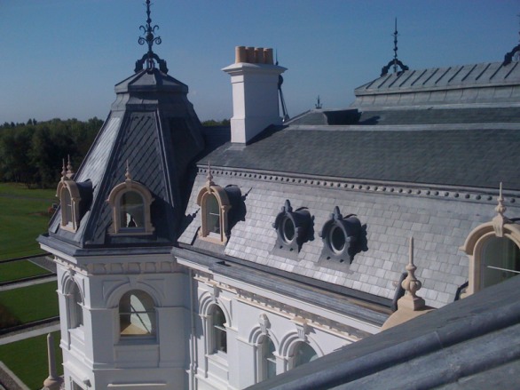 Slate mansard roof with lead dormers on a large historic house
